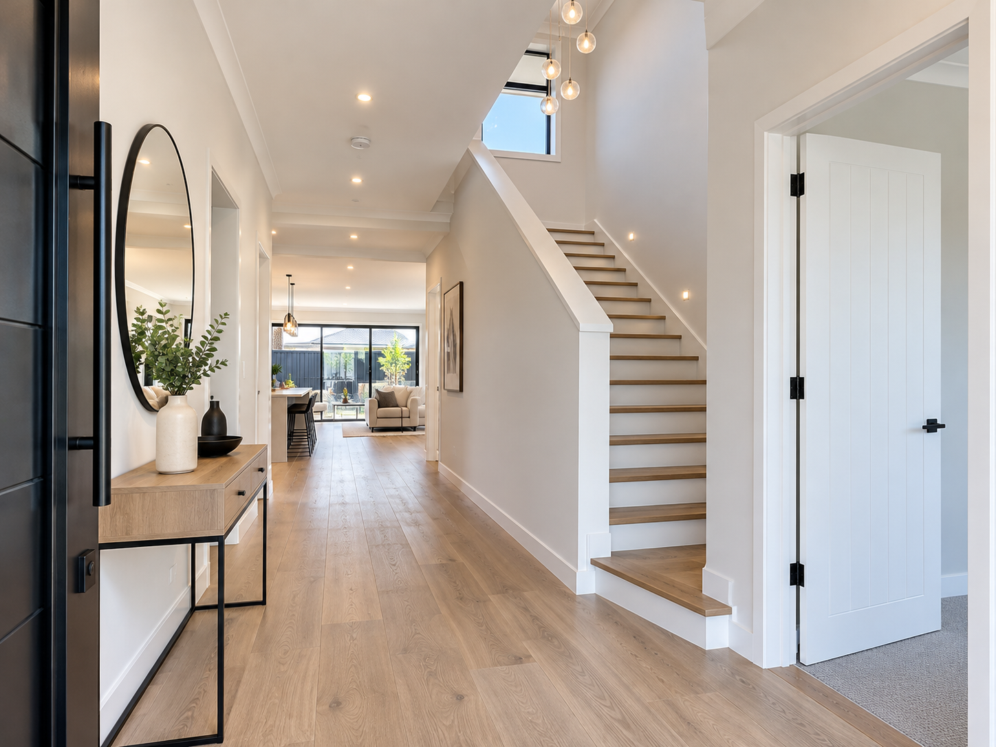 Modern professionally painted home interior with white walls and staircase